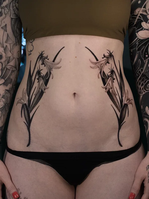 female black graphic 纹身 在 stomach #104430 | 纹身师 Nik Friday