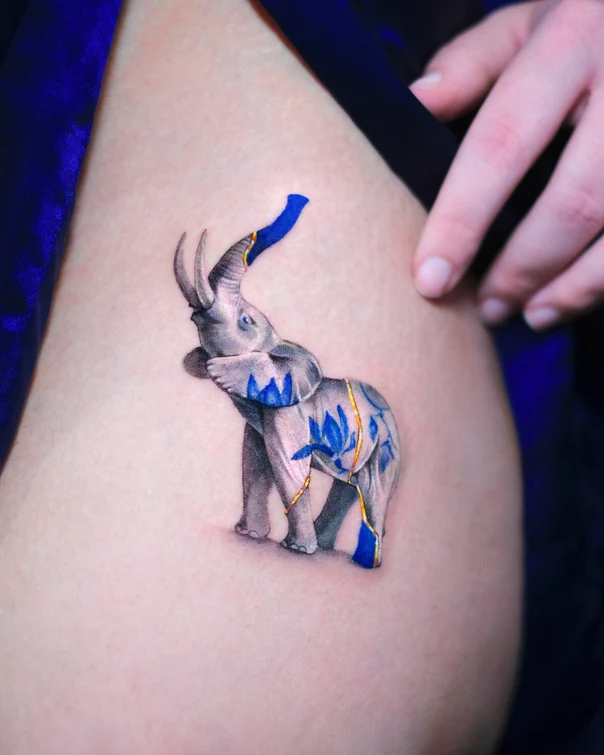 Illustrative Elephant, Floral tattoo on Thigh