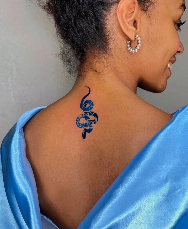 Tribal Snake tattoo on Back of neck