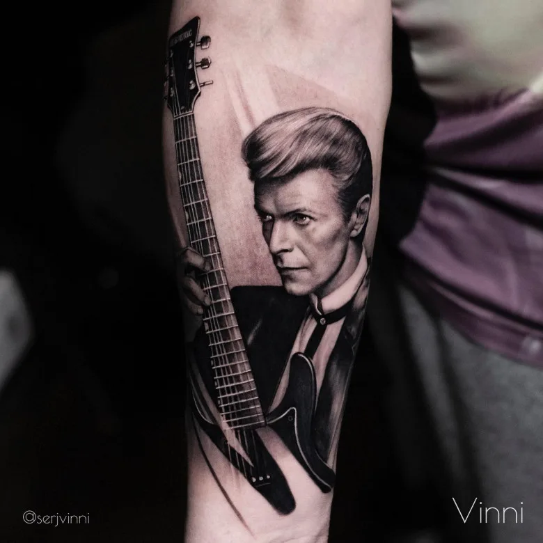 Photorealistic tattoo portrait of David Bowie by Sergey Vinni