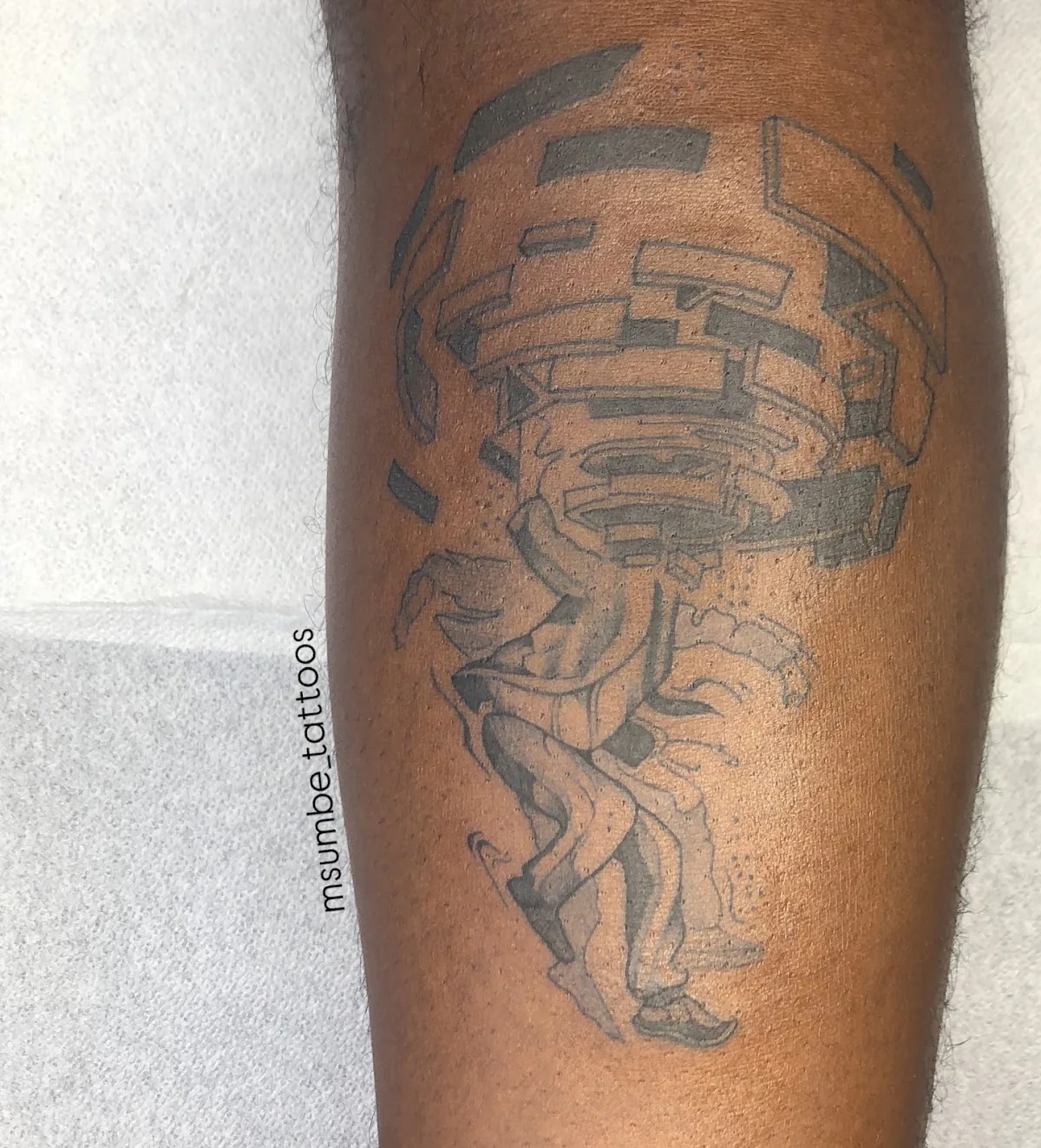 Tattoo by Msumbe tattoo and piercing shop at Msumbe tattoo and piercing shop