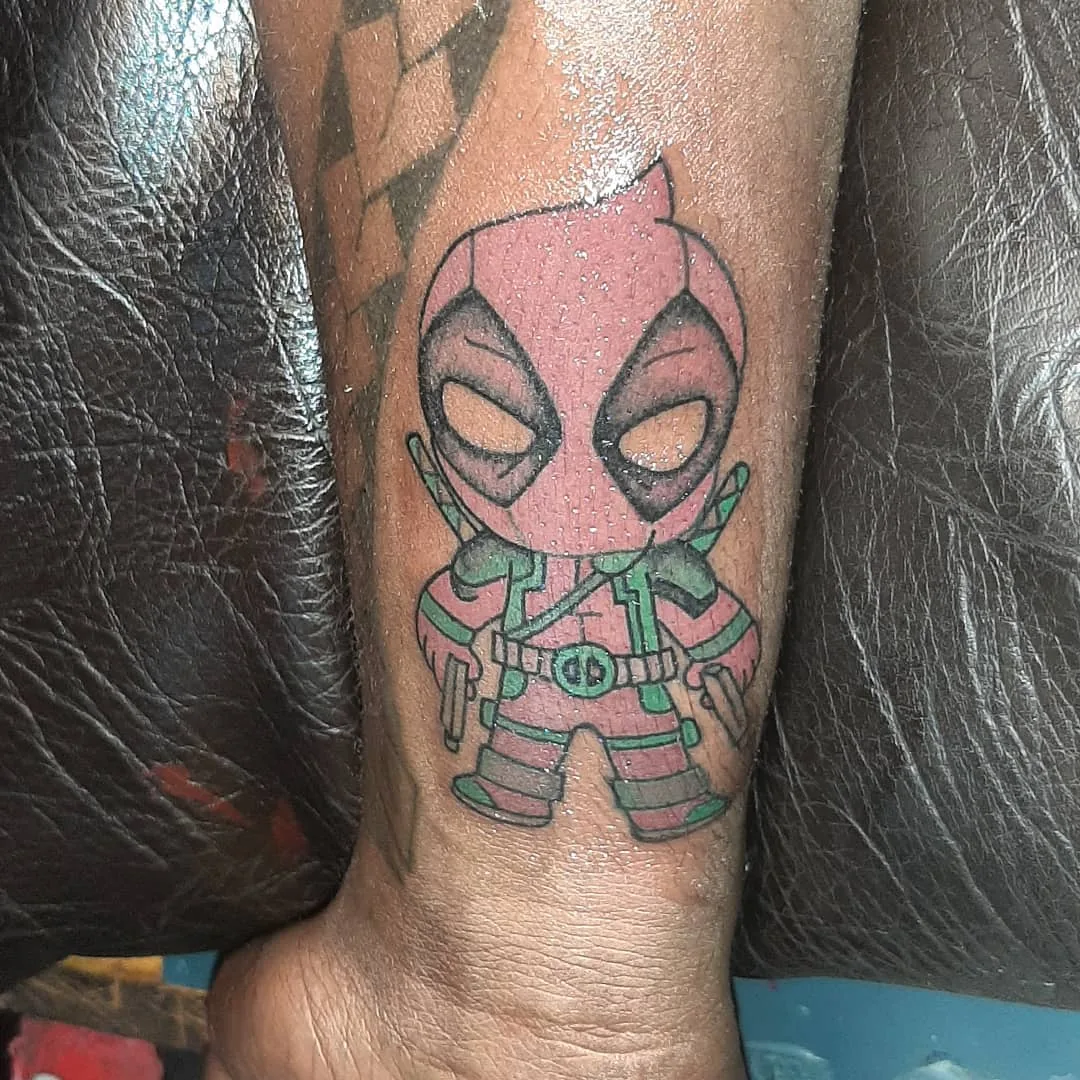 Tattoo by Msumbe tattoo and piercing shop at Msumbe tattoo and piercing shop