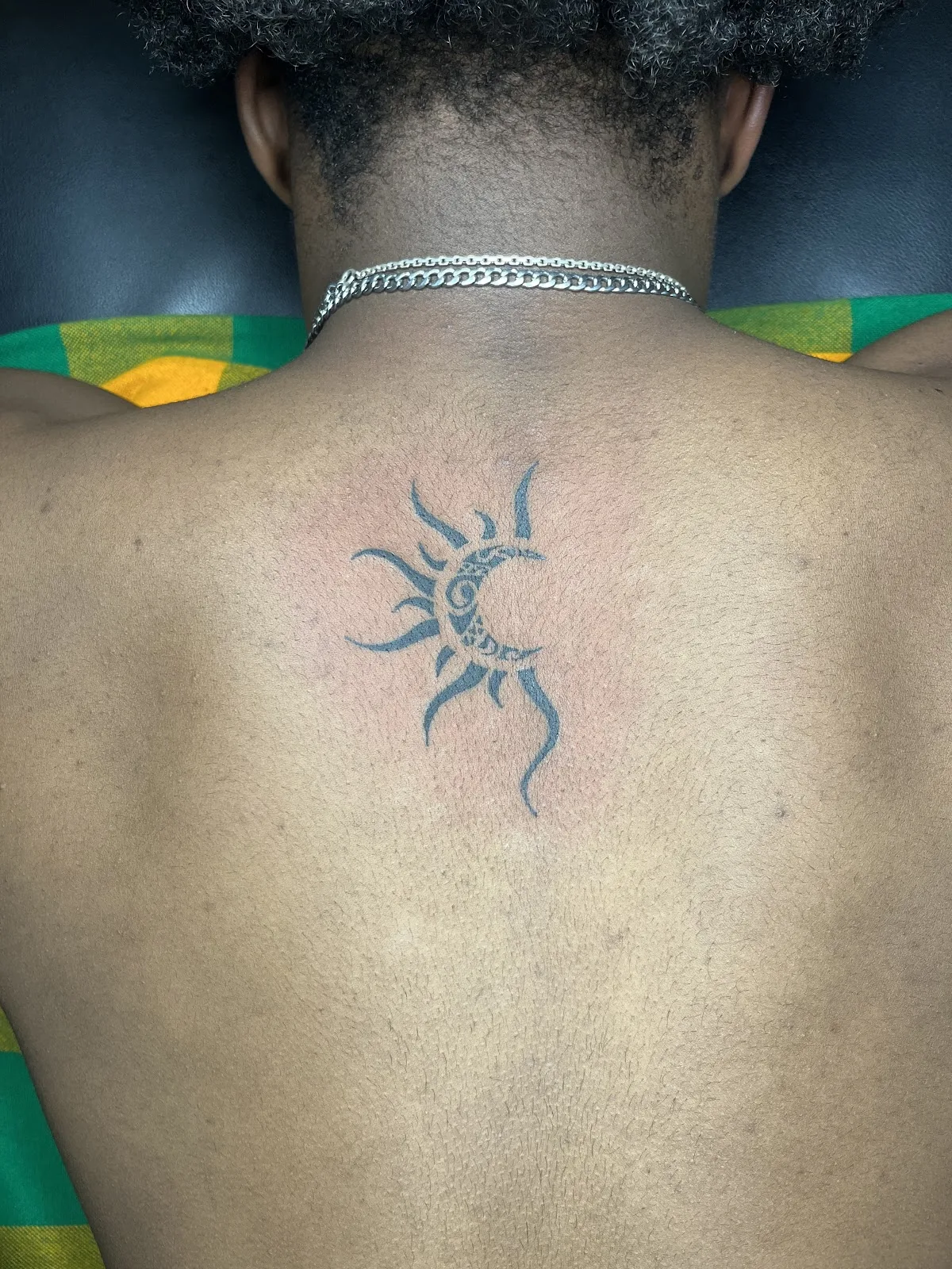 Tattoo by Msumbe tattoo and piercing shop at Msumbe tattoo and piercing shop