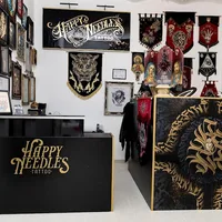 Happy Needles Tattoo