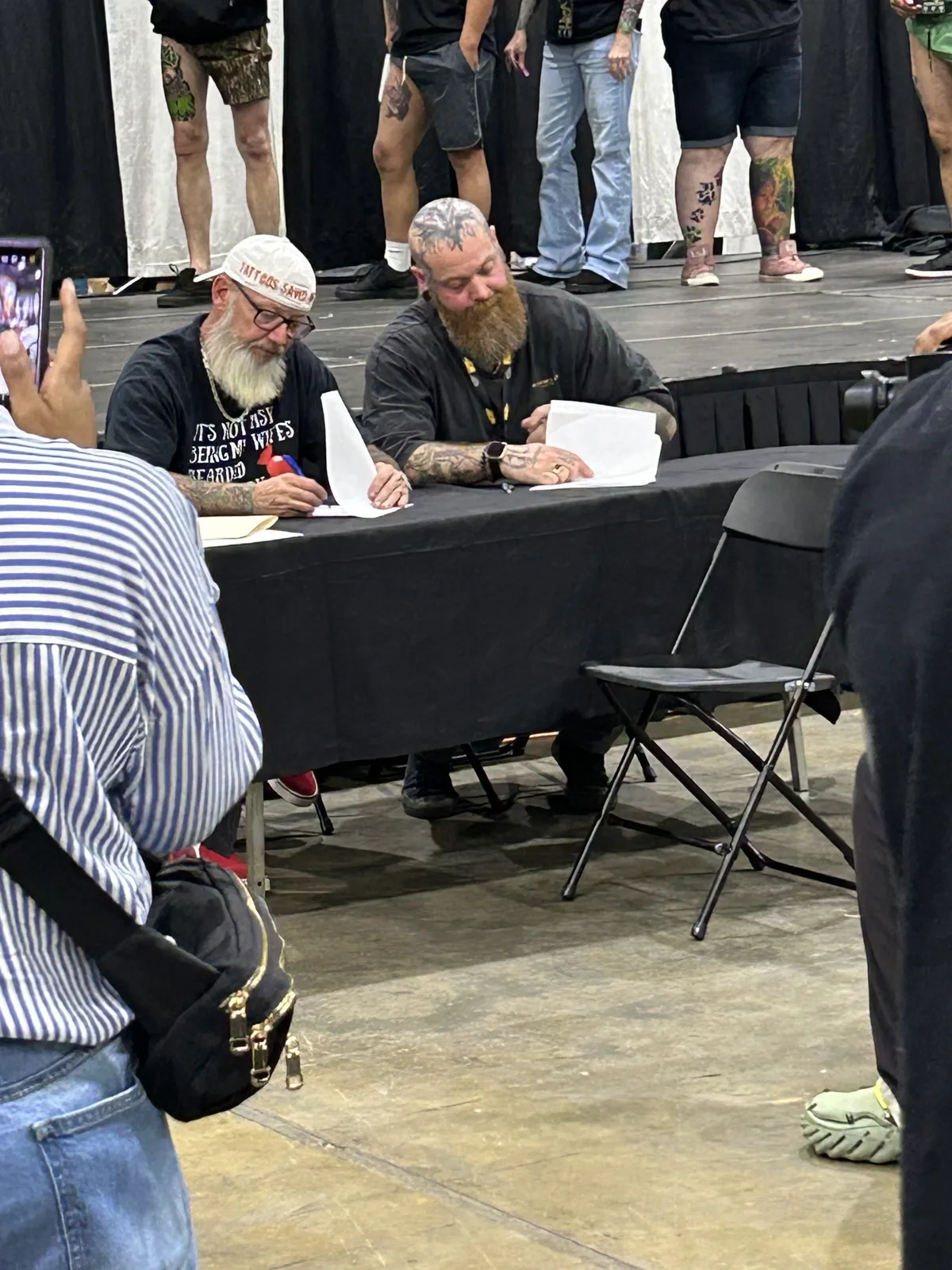 Eike Schumacher seated at a convention judges table
