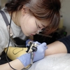 Tattoo artist Ovenlee
