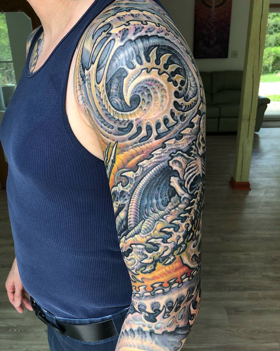 Unique Colored Ink Biomechanical Tattoo On Sleeve