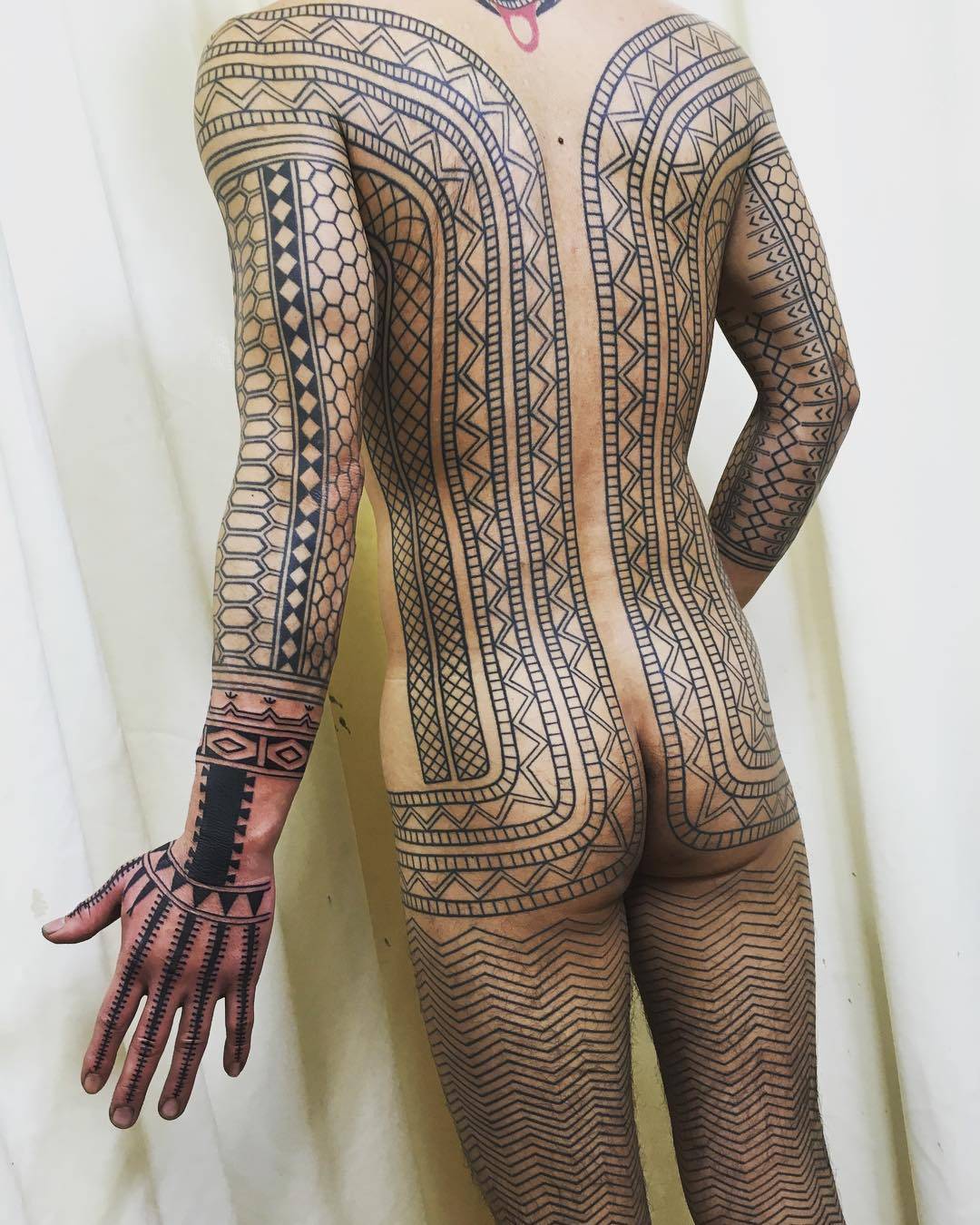 Impressively large Taku Oshima's tribal tattoos