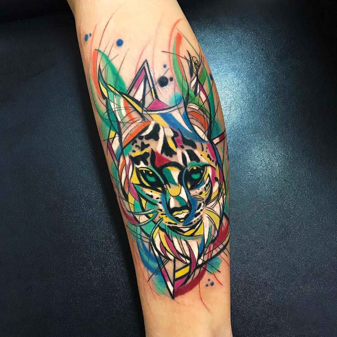Tattoo artist Sebastian Barone bright color cubism tattooo