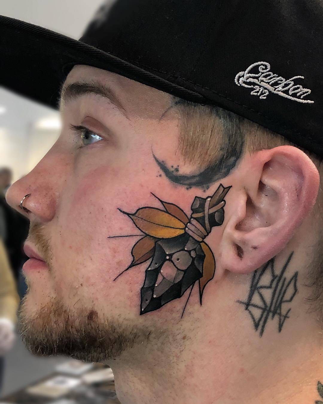 Tattoo artist Friedrich Übler, color new school face and head tattoo | Germany