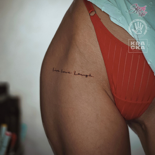 Female Black Calligraphy tattoo on Thigh #84996 | Tattoo Artist Yaroslav Stark