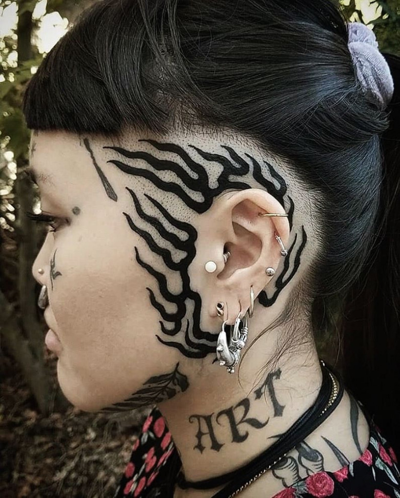 Candice Soleillant with tattoos on face