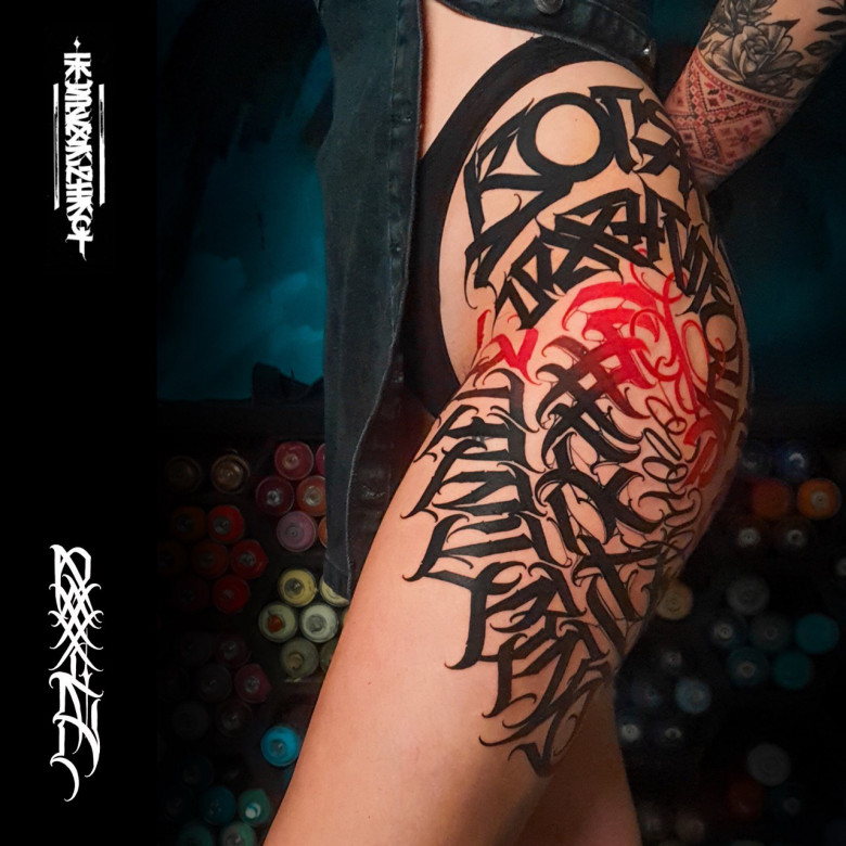 Lettering tattoo on the thigh - master Igor Klimin