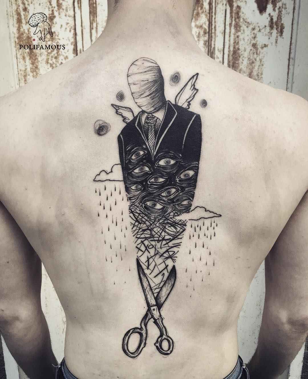 Tattoo artist Conio, black surrealistic tattoo