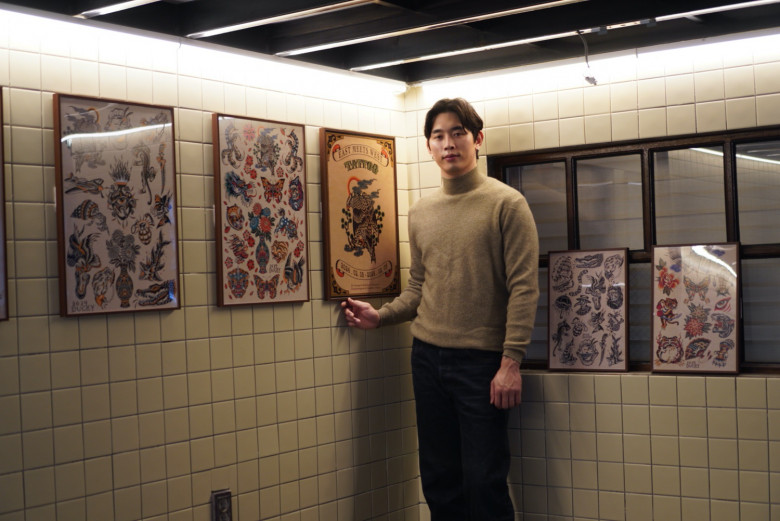 The tattoo artist Ducky at his solo exhibition