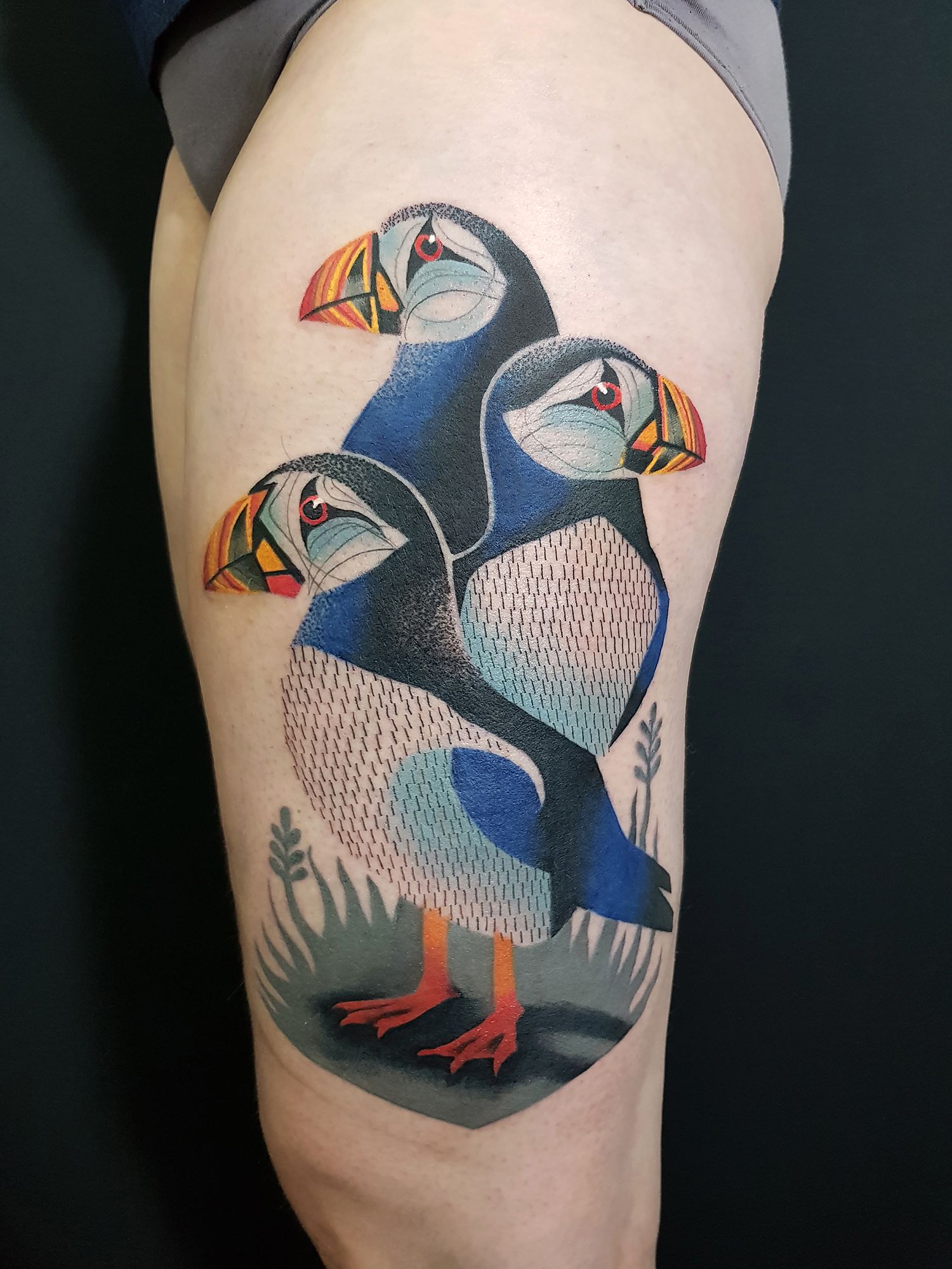 Dotwork style puffin tattoo locatred on the hip.