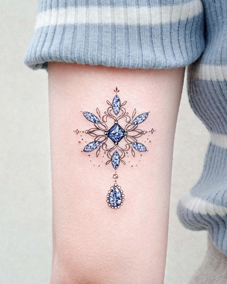 feminine snowflake tattoo design on arm for women   Snow flake tattoo  Tattoos Picture tattoos