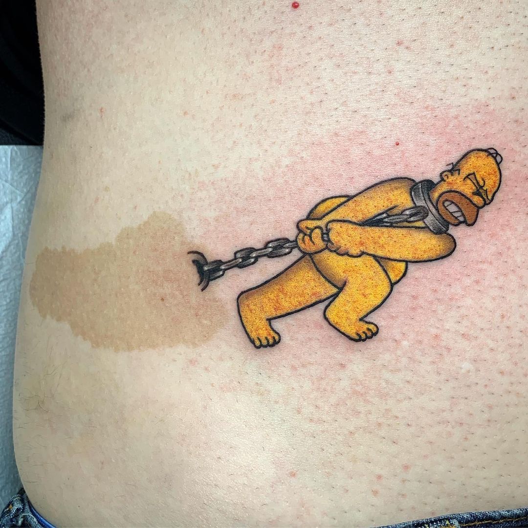 Homer Simpson drags a birthmark stone - tattoo