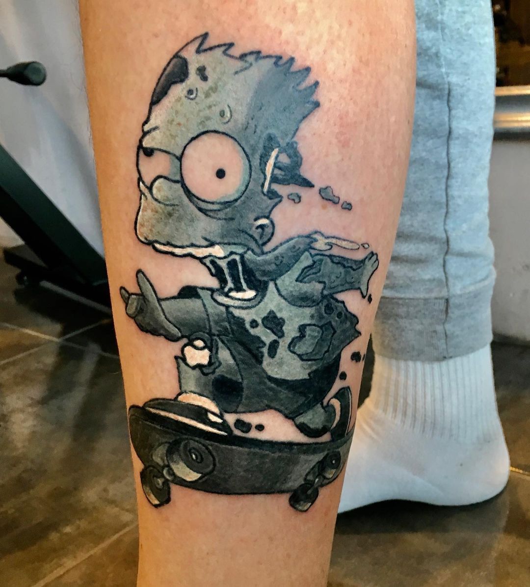 Bart splits on a skateboard tattoo